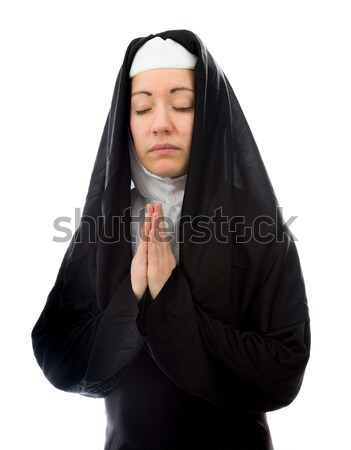 Young nun peeking through hands covering face Stock photo © bmonteny