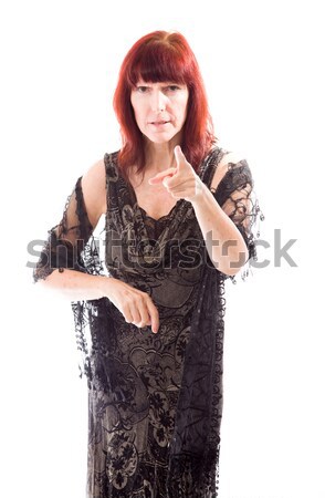 Mature woman standing with her arms akimbo Stock photo © bmonteny