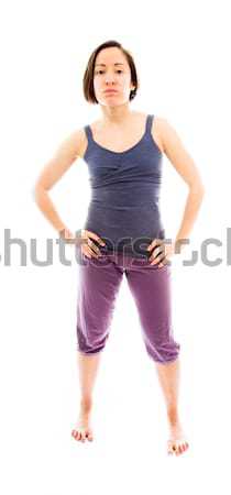 Young woman standing with her arms akimbo Stock photo © bmonteny