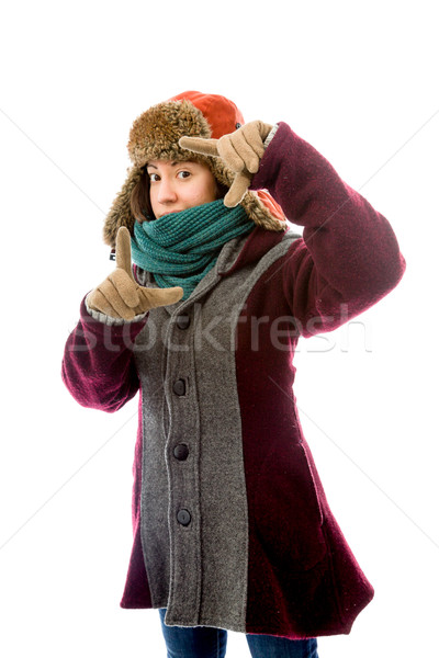 Young woman in warm clothing and making frame with fingers Stock photo © bmonteny