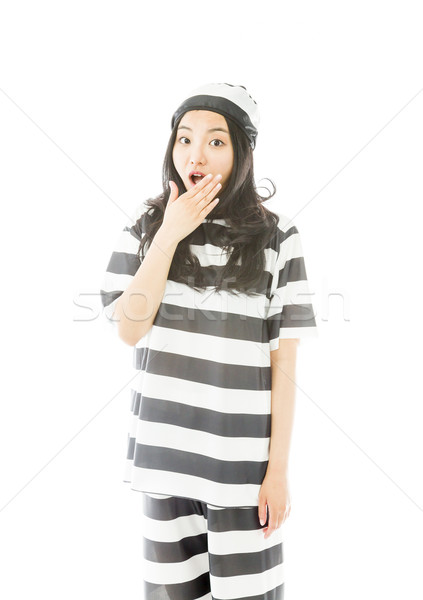 Young Asian woman with shocked expression in prisoner uniform Stock photo © bmonteny