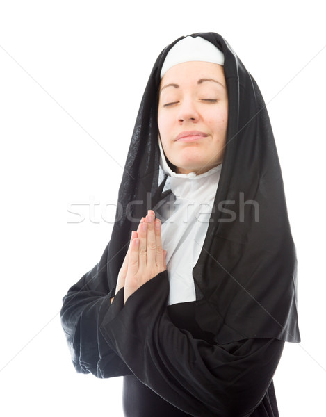 Young nun in prayer position Stock photo © bmonteny