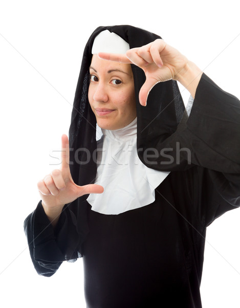Young nun making frame with fingers Stock photo © bmonteny