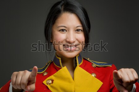 Asian air stewardess with finger in mouth Stock photo © bmonteny