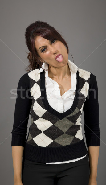 Indian businesswoman sticking out her tongue Stock photo © bmonteny