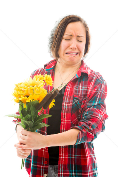 Worried young woman holding bouquet of sunflowers Stock photo © bmonteny
