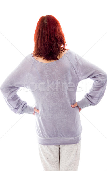 Rear view of a mature woman standing with her arms akimbo Stock photo © bmonteny