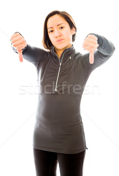 Young woman showing thumbs down sign from both hands Stock photo © bmonteny