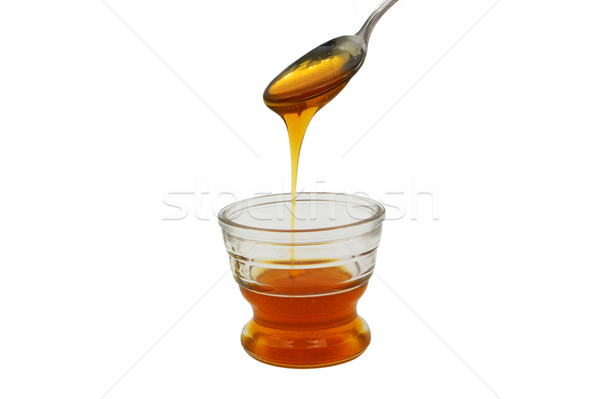 Méz áramló kicsi üveg tál részben Stock fotó © bobkeenan