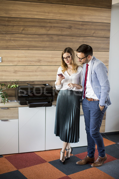 Business people talking in office by the scanner mashine Stock photo © boggy