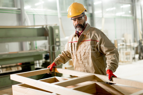 Middle aged worker working in the furniture factory Stock photo © boggy