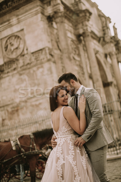 Young wedding couple by Arch of Constantine in Rome Stock photo © boggy