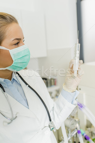 Female doctor with injection Stock photo © boggy