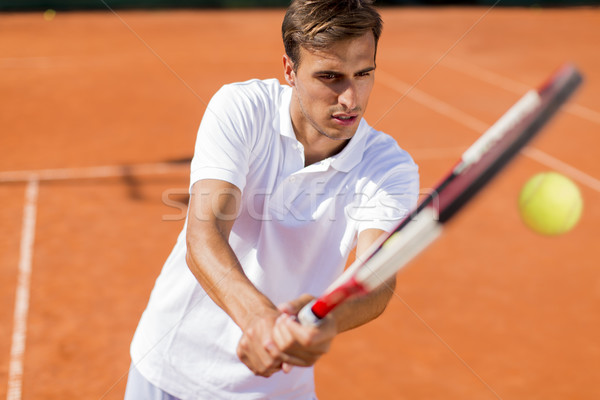 Junger Mann spielen Tennis Sommer jungen Ausbildung Stock foto © boggy