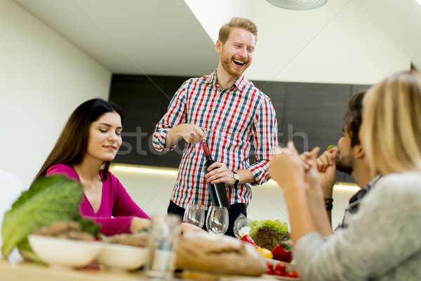 Young people at the table in kitchen Stock photo © boggy