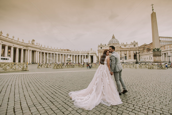Young wedding couple by Saint Peter cathedral in Vatican Stock photo © boggy