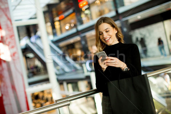 Modern woman in shopping mall Stock photo © boggy