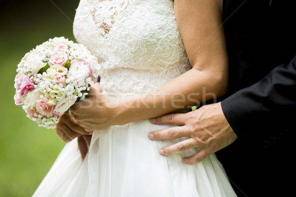 Wedding bouquet of roses in the hands of the bride Stock photo © boggy