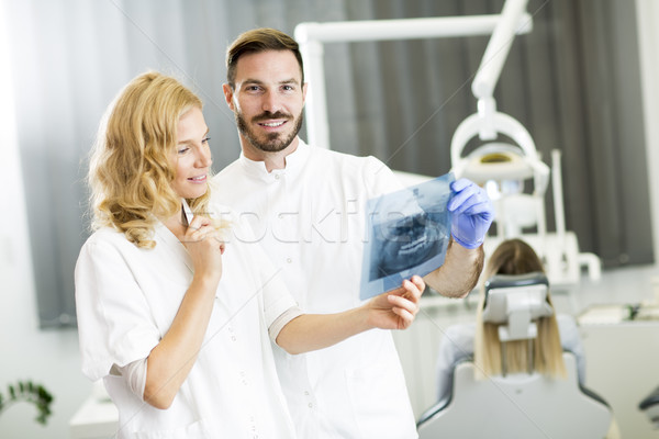 Dental specialist examine an x-ray of the tooth Stock photo © boggy
