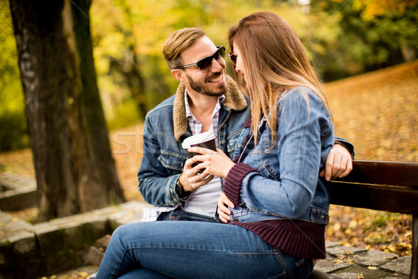 Stock photo: Young couple in the autumn park