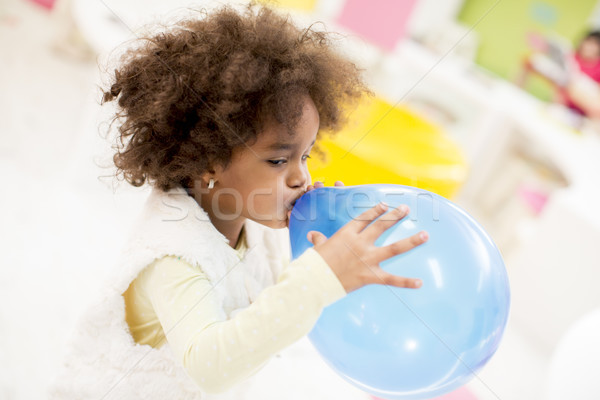 African american little girl with a balloon Stock photo © boggy