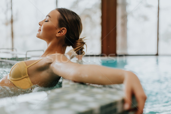 Young woman relaxing in the whirlpool bathtub Stock photo © boggy
