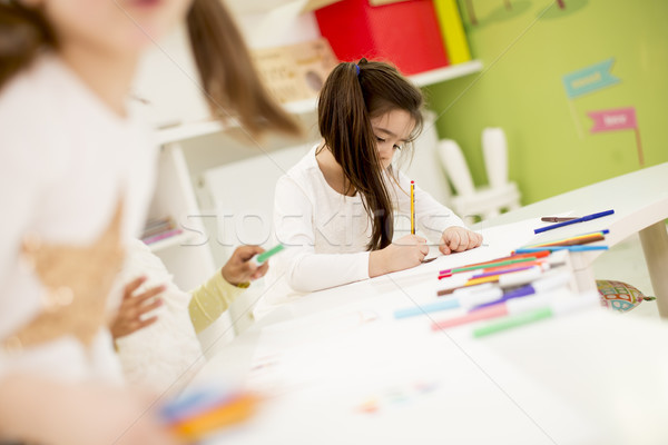 Multiracial children drawing in the playroom Stock photo © boggy