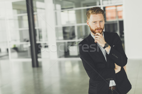 Modern redhair man posing in the office Stock photo © boggy