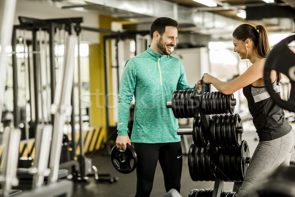 Woman and trainer in the gym Stock photo © boggy