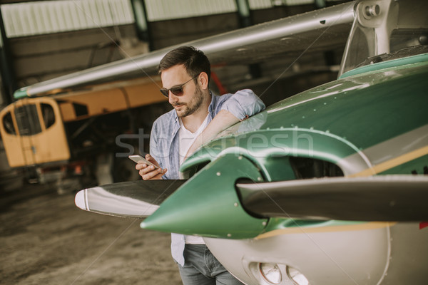 Jóvenes piloto avión vuelo guapo tecnología Foto stock © boggy