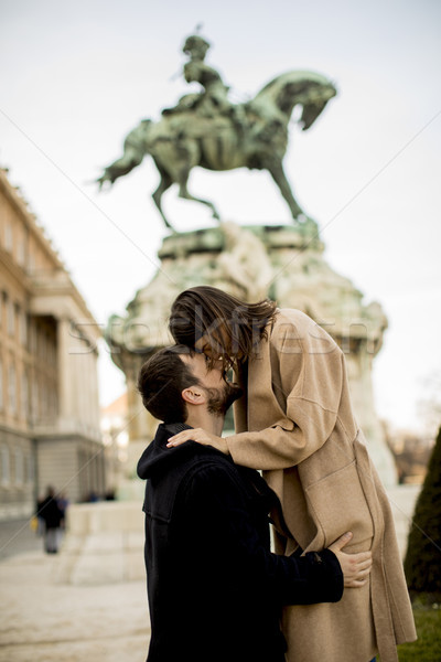 Loving couple outdoor with monument in background in Budapest Stock photo © boggy
