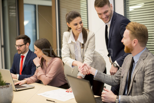 Business partners analyze the business results in modern office Stock photo © boggy