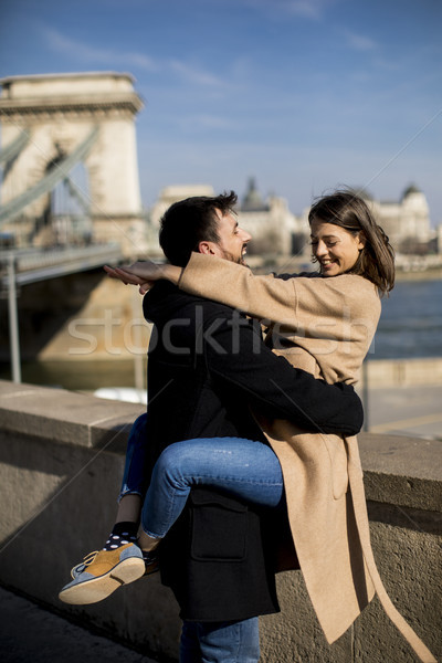 Couple in love hugging of the magnificent landscape view of Buda Stock photo © boggy