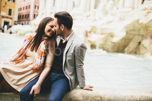 tourist couple on travel by Trevi Fountain in Rome, Italy. Stock photo © boggy