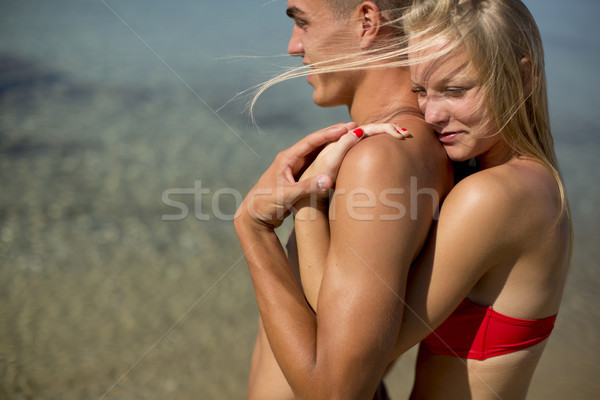 Happy lovers at the beach Stock photo © boggy