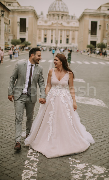 Young wedding couple by Saint Peter cathedral in Vatican Stock photo © boggy