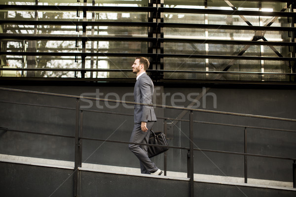 Businessman in suit with leather handbag goes to work Stock photo © boggy
