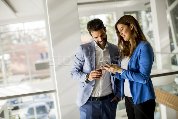 Young business people standing in the office Stock photo © boggy