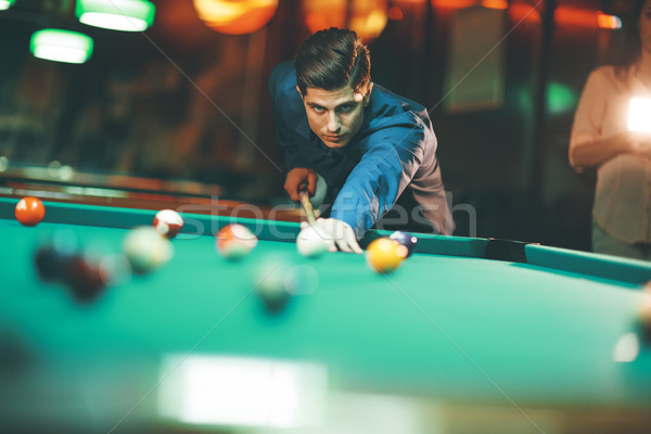 Young man playing pool Stock photo © boggy