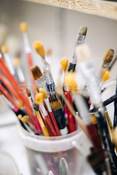 Group of brushes from the pottery workshop Stock photo © boggy