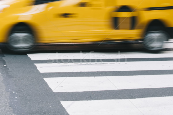 Abstract blur of urban street scene with a yellow taxi cab in Ne Stock photo © boggy