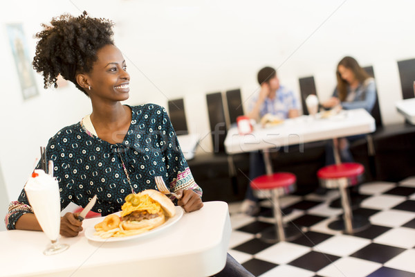 非裔美國人 女子 用餐者 年輕 吃 晚餐 商業照片 © boggy
