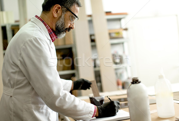 Engineer in the laboratory examines ceramic tiles Stock photo © boggy