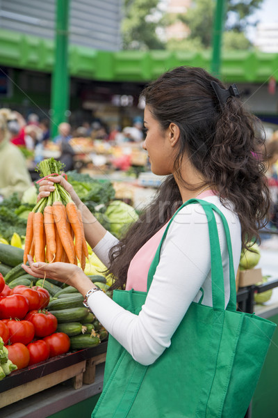 Young woman at the market Stock photo © boggy