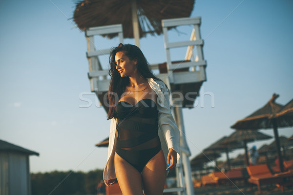 Young woman posing on the beach Stock photo © boggy