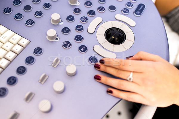 Doctor working on ultrasounds keyboard Stock photo © boggy