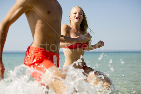 Young couple having fun in the sea Stock photo © boggy