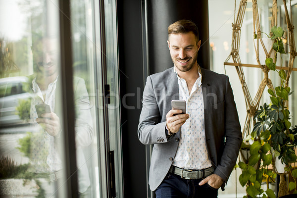 Adam telefon genç yakışıklı adam cep telefonu telefon Stok fotoğraf © boggy