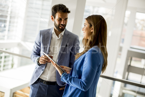 Young business people standing in the office Stock photo © boggy