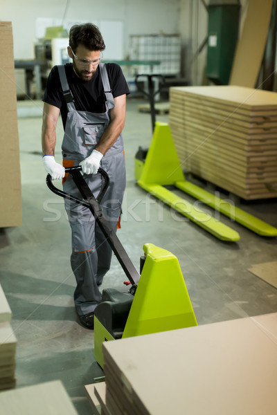 Male worker working in furniture industry Stock photo © boggy